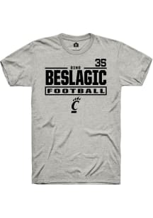 Dino Beslagic Cincinnati Bearcats Ash Football NIL Stacked Box Short Sleeve Player T Shirt