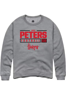 Jake Peters  Rally Nebraska Cornhuskers Mens Graphite NIL Stacked Box Long Sleeve Crew Sweatshirt